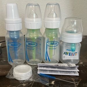 Lot of four brand new baby bottles.